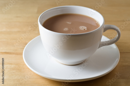 Photo: Tea Cup and Saucer on Table Tea Cup and Saucer on Table