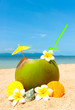 Ocean beach with palm and and exotic coctail