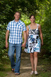 Happy Couple Walking in Woods