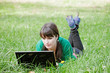 Active beautiful young sexy girl relaxing with laptop