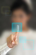 Hand pressing virtual button on futuristic holographic screen.