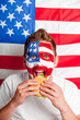 American man eating hamburger