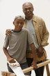 African grandfather and grandson doing carpentry