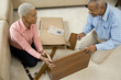 African couple assembling shelf