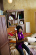 Ecuadorian woman looking at cushion in shop