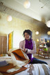 Ecuadorian woman looking at fabric in shop
