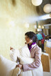 Ecuadorian woman looking at cushions in shop