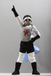 Korean boy in superhero costume with arm raised