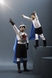 Korean boy in superhero costume flying while father watches
