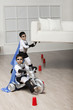 Korean superhero boy lifting sofa for brother to ride underneath