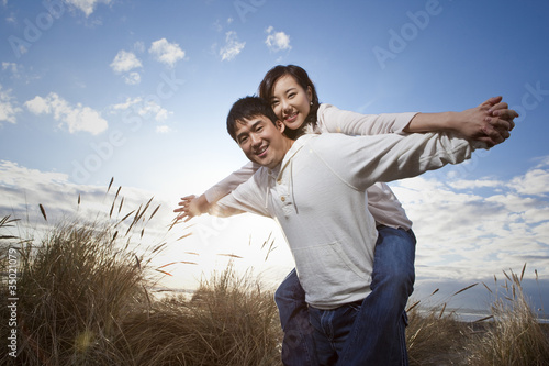 Photo: Korean man giving girlfriend piggyback ride Korean man giving girlfriend piggyback ride