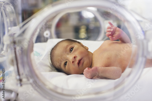 Hispanic baby in intensive care unit