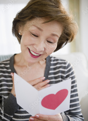Photo: Japanese woman reading valentine card Japanese woman reading valentine card