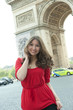 Caucasian woman standing near Arc de Triomphe
