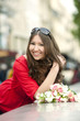 Smiling Caucasian woman holding bouquet