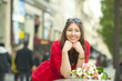 Smiling Caucasian woman with bouquet