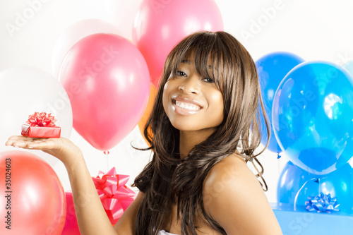 Photo: African American woman with birthday presents African American woman with birthday presents