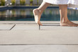 Foto: Woman walking near swimming pool Woman walking near swimming pool