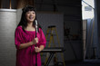 Asian woman singing into microphone