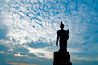 Standing buddha image on beautiful blue sky Standing buddha image on beautiful blue sky