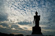 Standing buddha image on beautiful blue sky Standing buddha image on beautiful blue sky