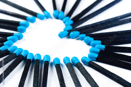 Photo: Matches on white in the shape of a heart Matches on white in the shape of a heart