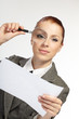 woman holding a magnifying glass in the hand woman holding a magnifying glass in the hand