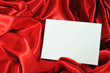 Foto: Blank card on red silk Blank card on red silk