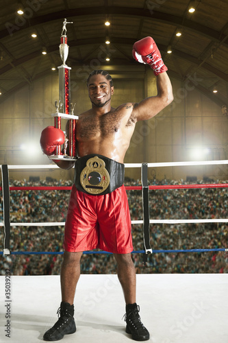Photo: Winning African American boxer in boxing ring Winning African American boxer in boxing ring