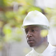Serious Black man in hard-hat