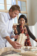 Architects reviewing building model in office