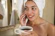 Mixed race woman drinking coffee in the morning