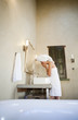 Mixed race woman washing face in the morning