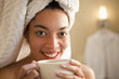 Mixed race woman drinking coffee in the morning