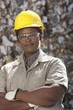Black sanitation worker in recycling plant