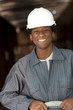 Black sanitation worker working in recycling plant