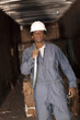 Black sanitation worker working in recycling plant