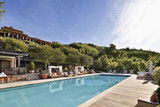 Photo: Expansive pool and lounge area at a luxury resort in Napa Valley wine country California Expansive pool and lounge area at a luxury resort in Napa Valley wine country California