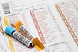 Volante medico in spanish con tubos de sangre y orina Volante medico in spanish con tubos de sangre y orina
