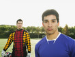 Soccer players standing on soccer field