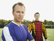 Soccer players standing on soccer field