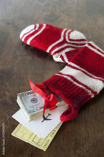 Photo: Christmas stocking with airline tickets and cash Christmas stocking with airline tickets and cash
