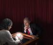 Businessman visiting fortune teller with crystal ball