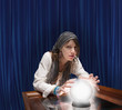 Mixed race fortune teller with crystal ball