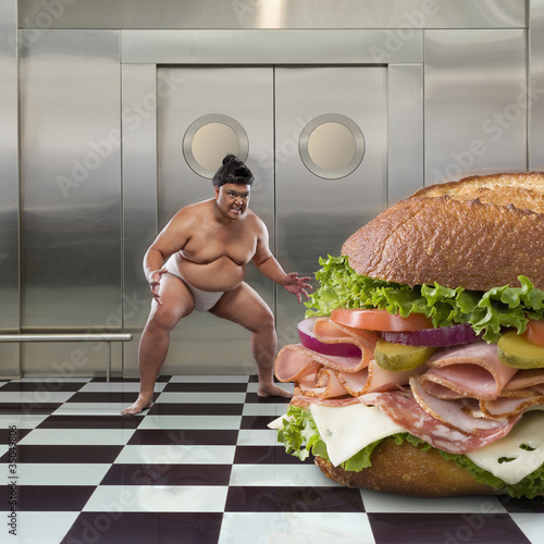 Photo: Sumo wrestler next to large sandwich Sumo wrestler next to large sandwich