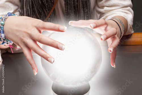 Foto: Mixed race fortune teller with crystal ball Mixed race fortune teller with crystal ball