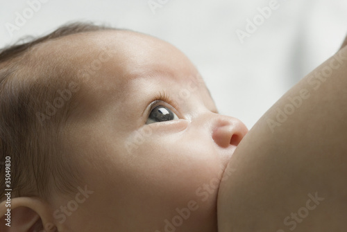 Photo: Close up of Hispanic baby breast feeding Close up of Hispanic baby breast feeding