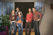 Family standing together in entryway