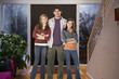 Brother and sisters standing in entryway together