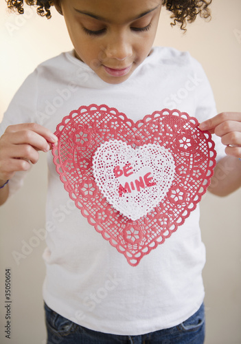 Photo: African American girl holding Valentine African American girl holding Valentine